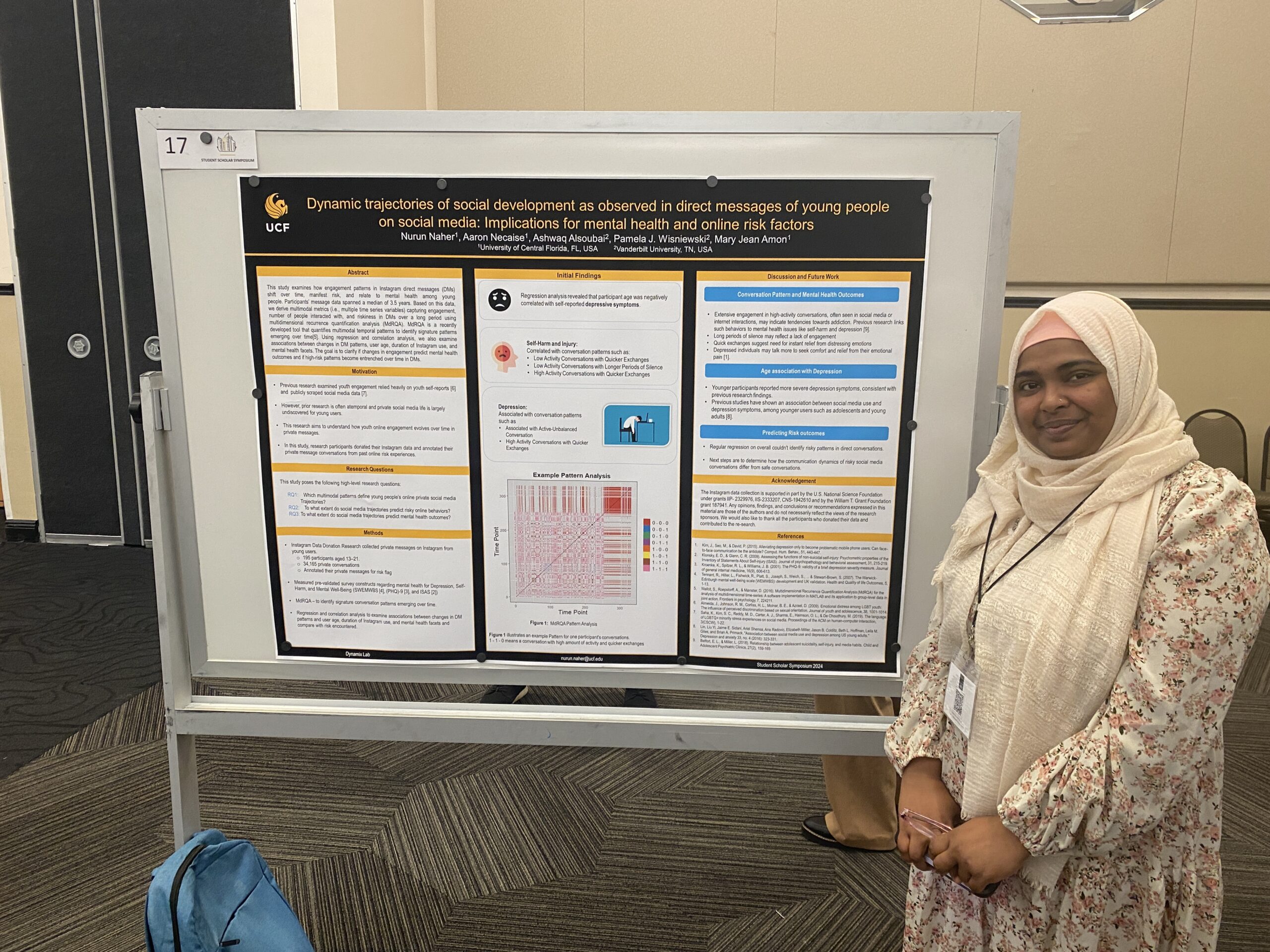 student with poster at Student Research Week