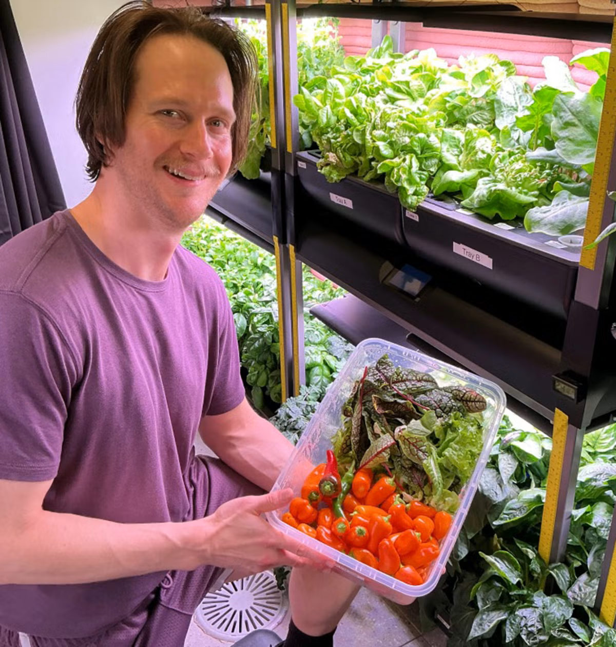 Matthew Montgomery with hydroponic crop